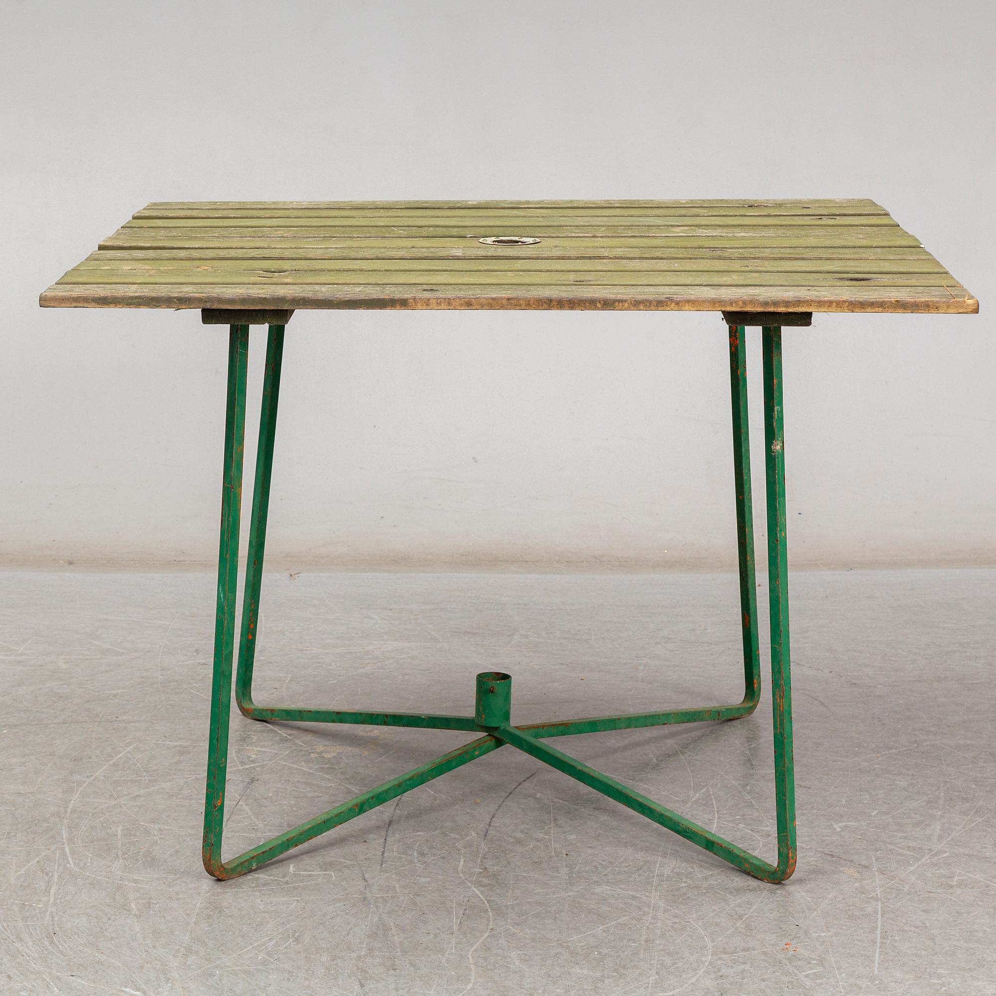 Three Arbrå stålmöbler and Grythyttan garden armchairs and a table, mid 20th century.