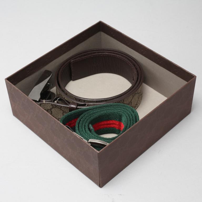 Two Gucci belts.