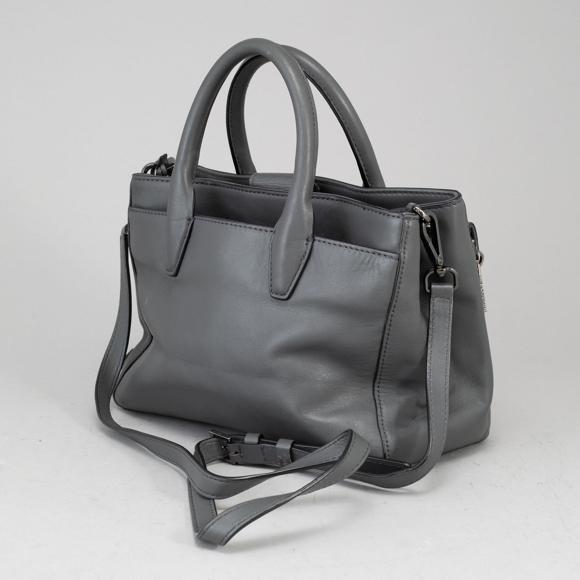 DIANE VON FÜRSTEBERG, a grey leather 'DVF Secret Agent' bag.