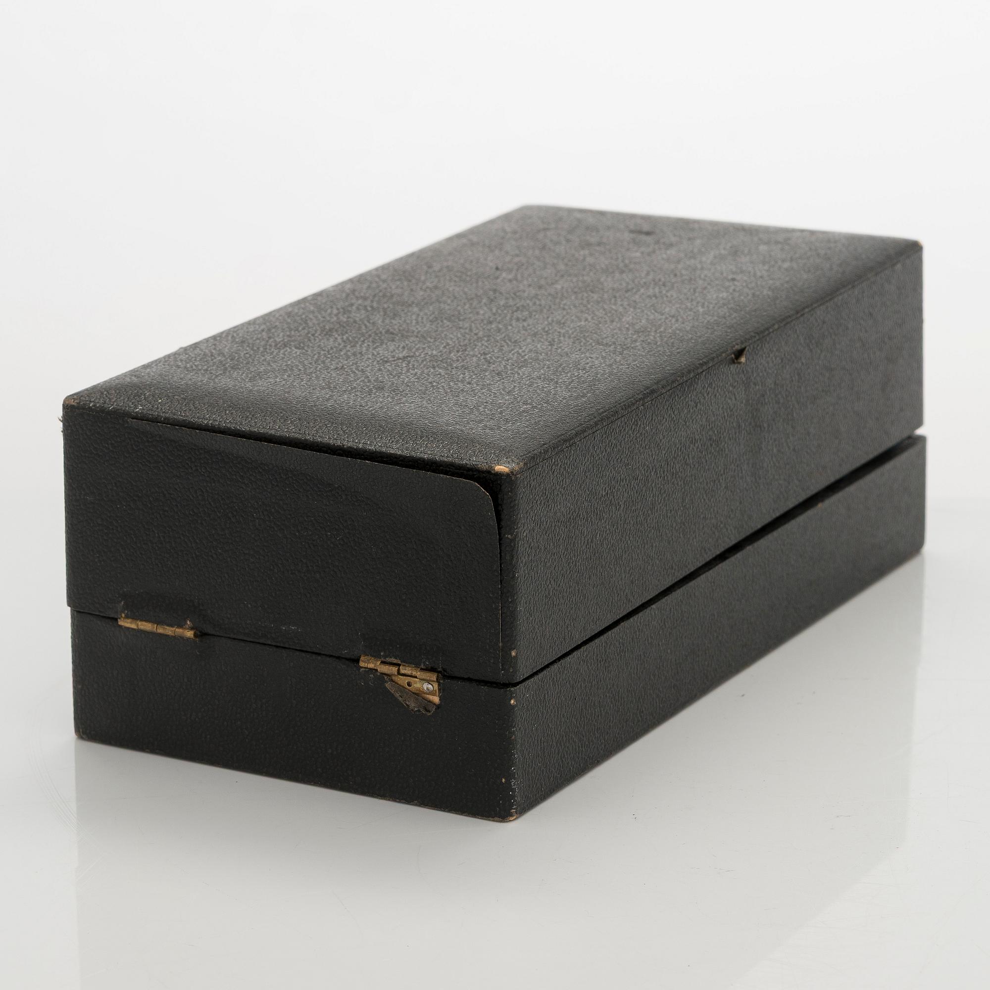 A 12-piece set of silver glass coasters, Kultakeskus, Hämeenlinna 1952. In original fitted case.