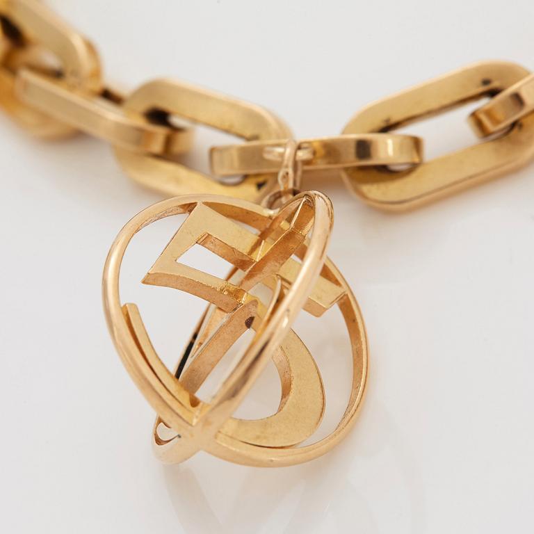 Armband 18K guld med berlocker.