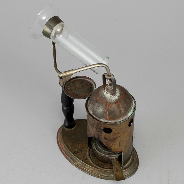 A tinplate burner, 20th century.