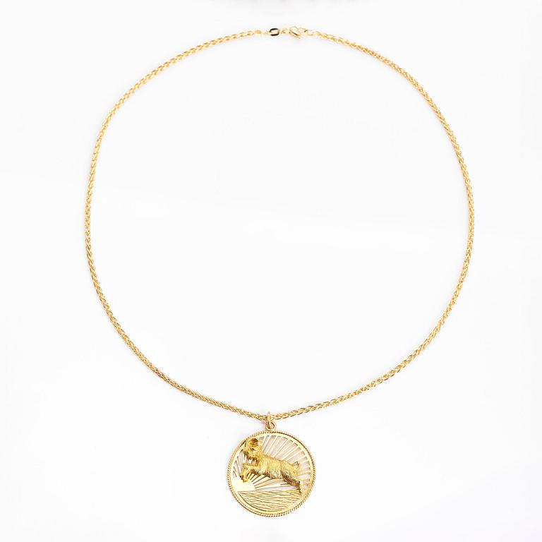 A horoscope Airies pendant with chain in 18K gold.