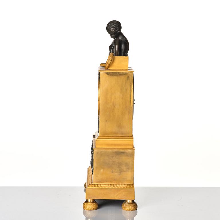 A French Empire early 19th century mantel clock, by Antoine André Ravrio.
