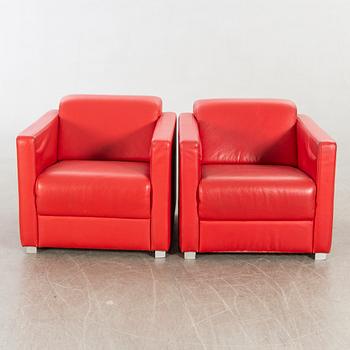 A pair of Italian 1990's leather armchairs.