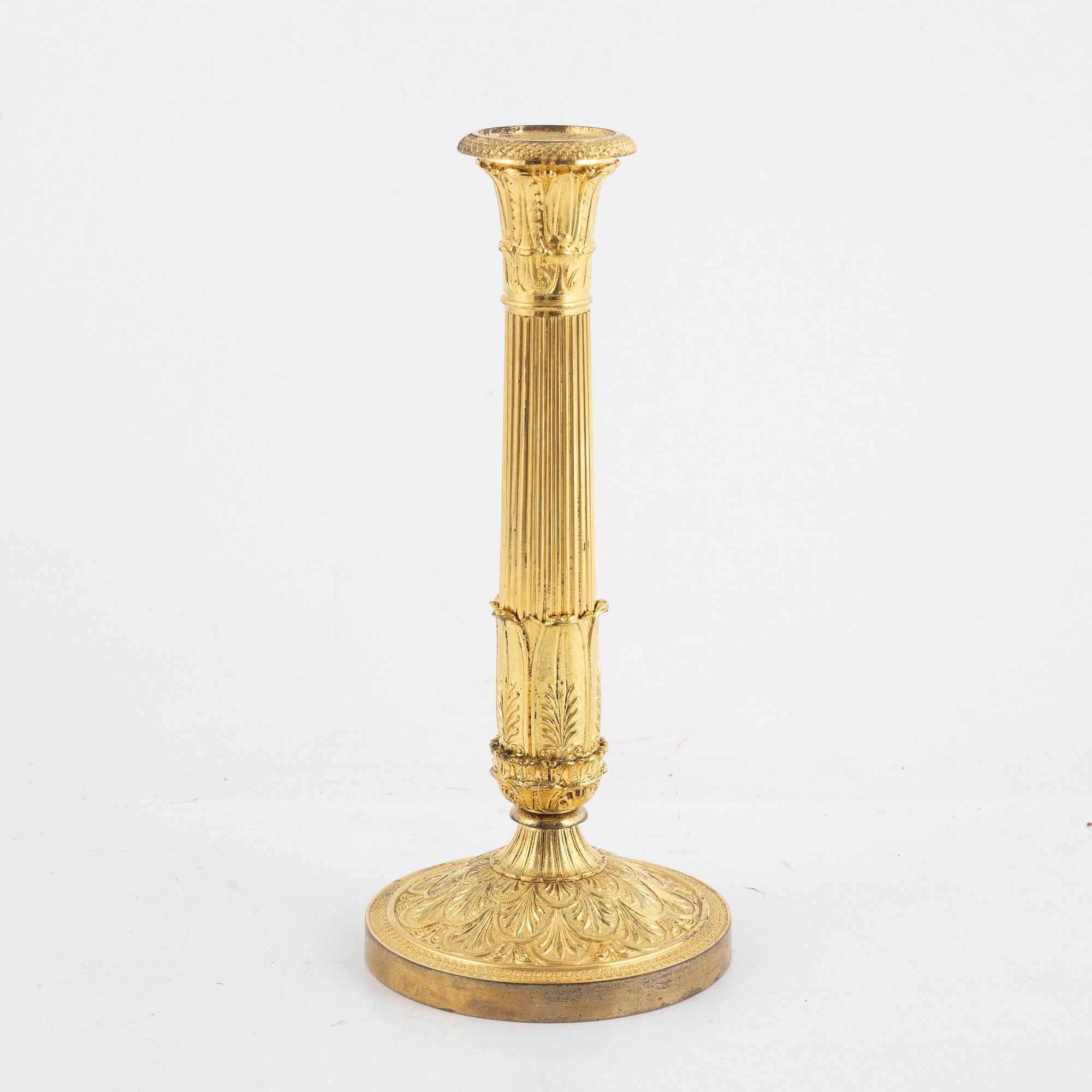 A French Empire gilt-bronze candlestick, early 19th century,