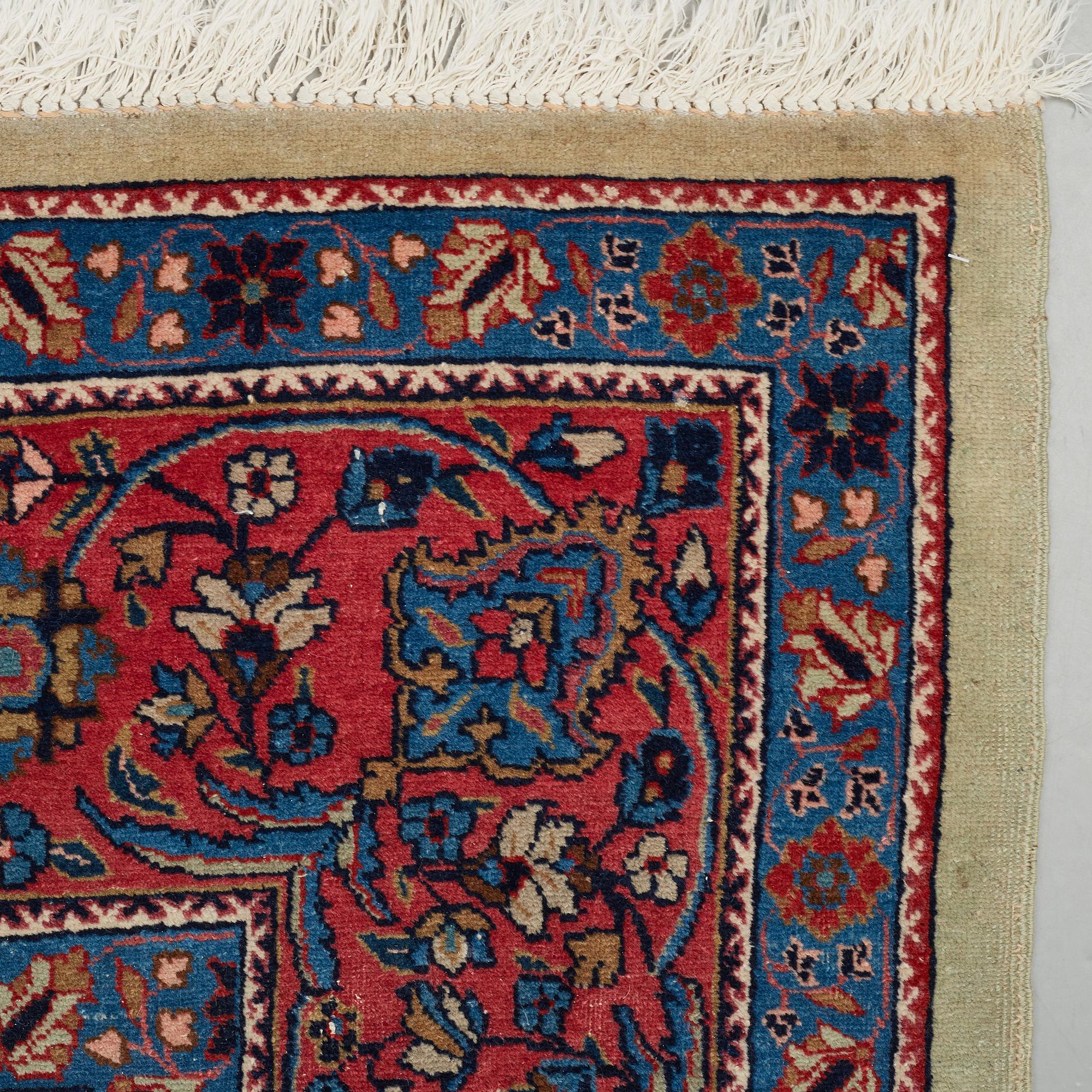 A CARPET, a semi-antique Tabriz probably, ca 393 x 284 cm.