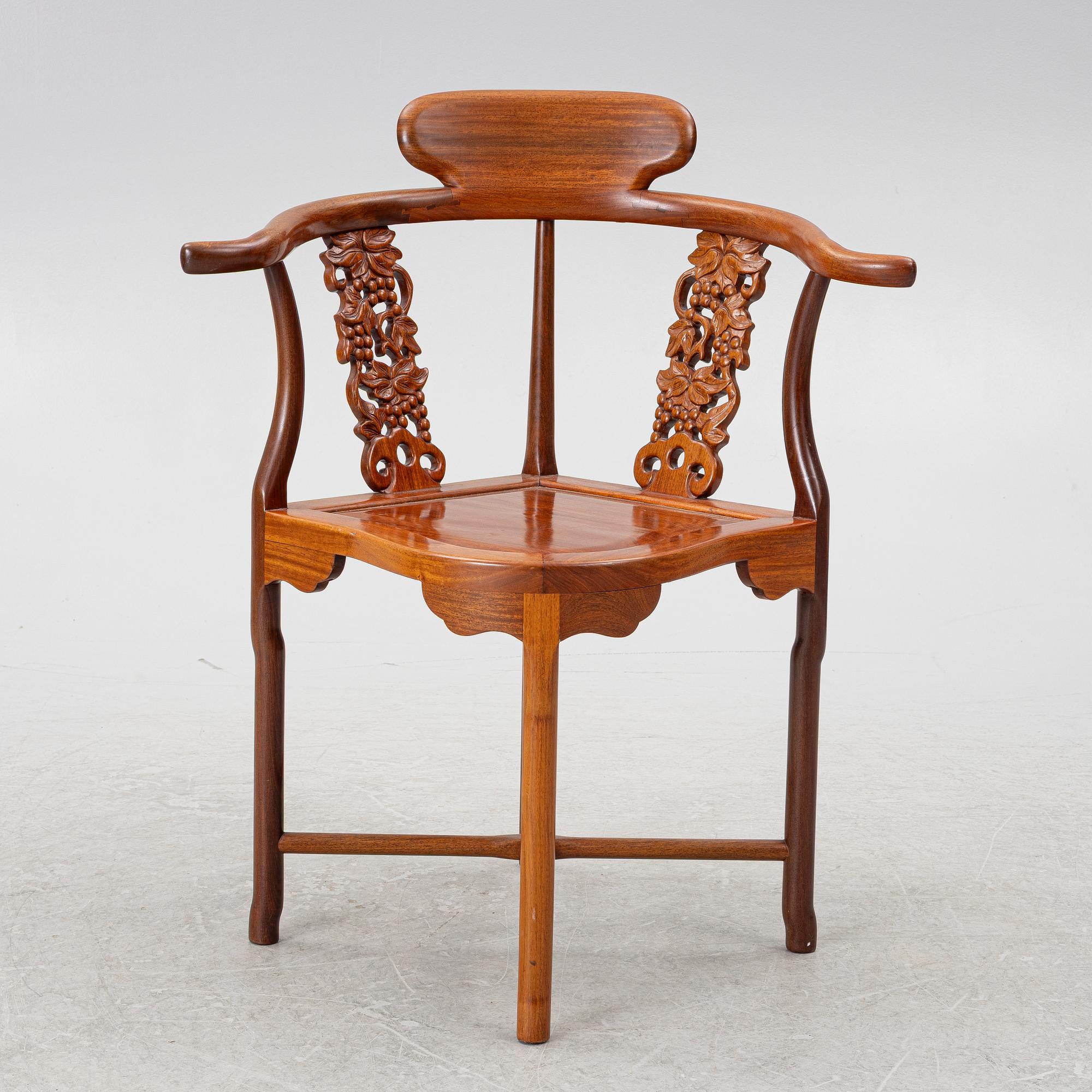 A Chinese hardwood corner armchair, 1900s.