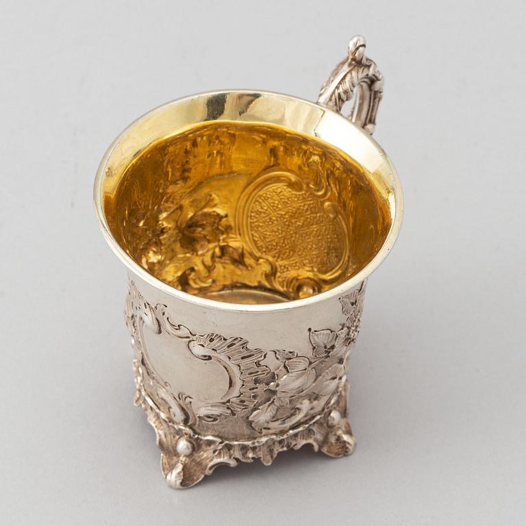 A parcel-gilt Rococo Revival silver jug, mark of Charles Fox II, London 1839.