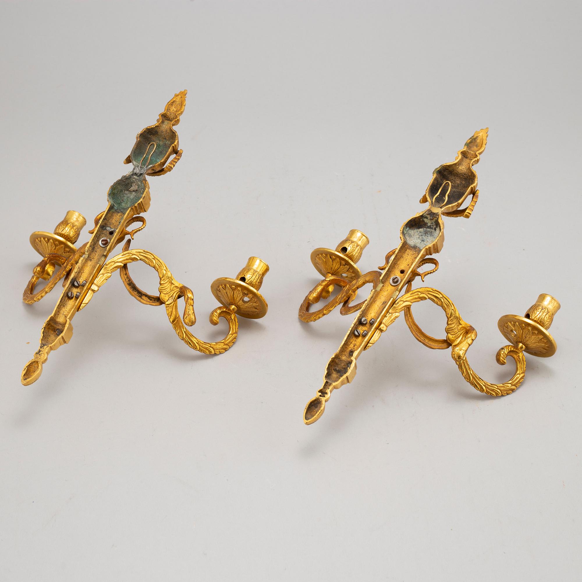 A pair of wall sconces, Louis XVI style, early 20th century.