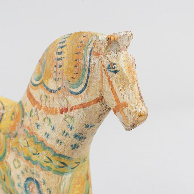 A painted Swedish wooden horse from the first half of the 20th century.