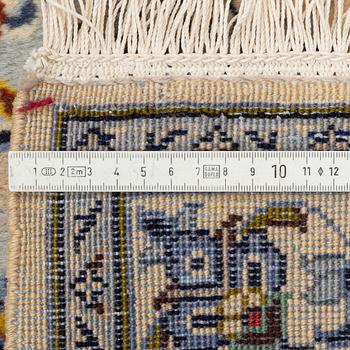 A carpet, semi-antique, Kashan, ca 398 x 281 cm.
