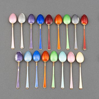 A mixed lot of 35 silver spoons, a tea strainer and two small dishes, parcel-gilt guilloché enamel, Norway, 20th century.