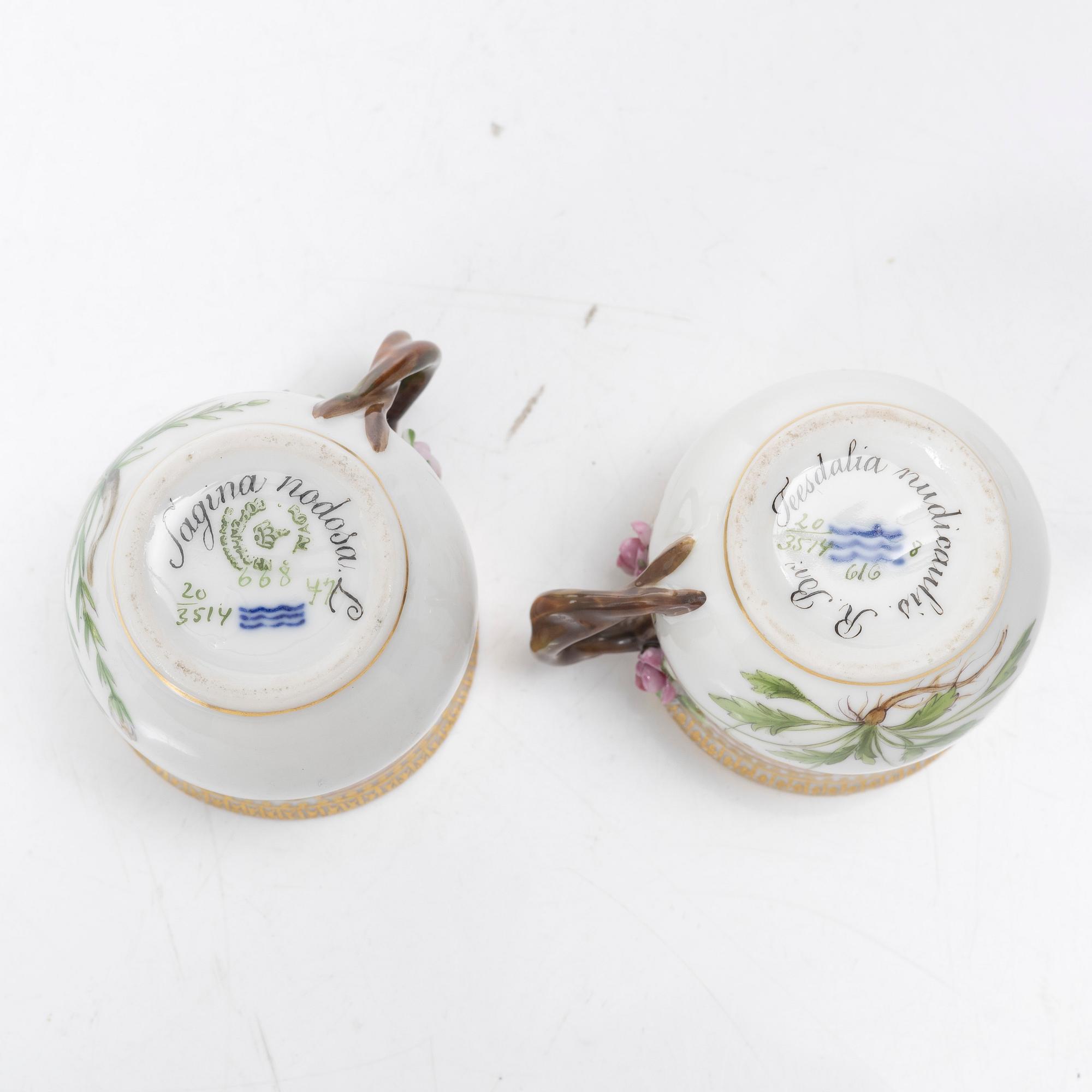 A pair of Royal Copenhagen 'Flora Danica' custard cups with covers and stands, Denmark, 20th century.