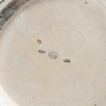 Three Silver Shakers and a Beaker.