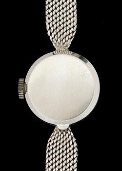 DAMARMBANDSUR, vitguld 18k, två små briljantslipade diamanter, Movado. Vikt ca 22 gram.