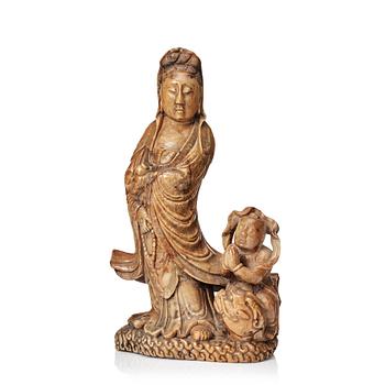 746. A soapstone sculpture of Guanyin with an attendant, Qing dynasty.