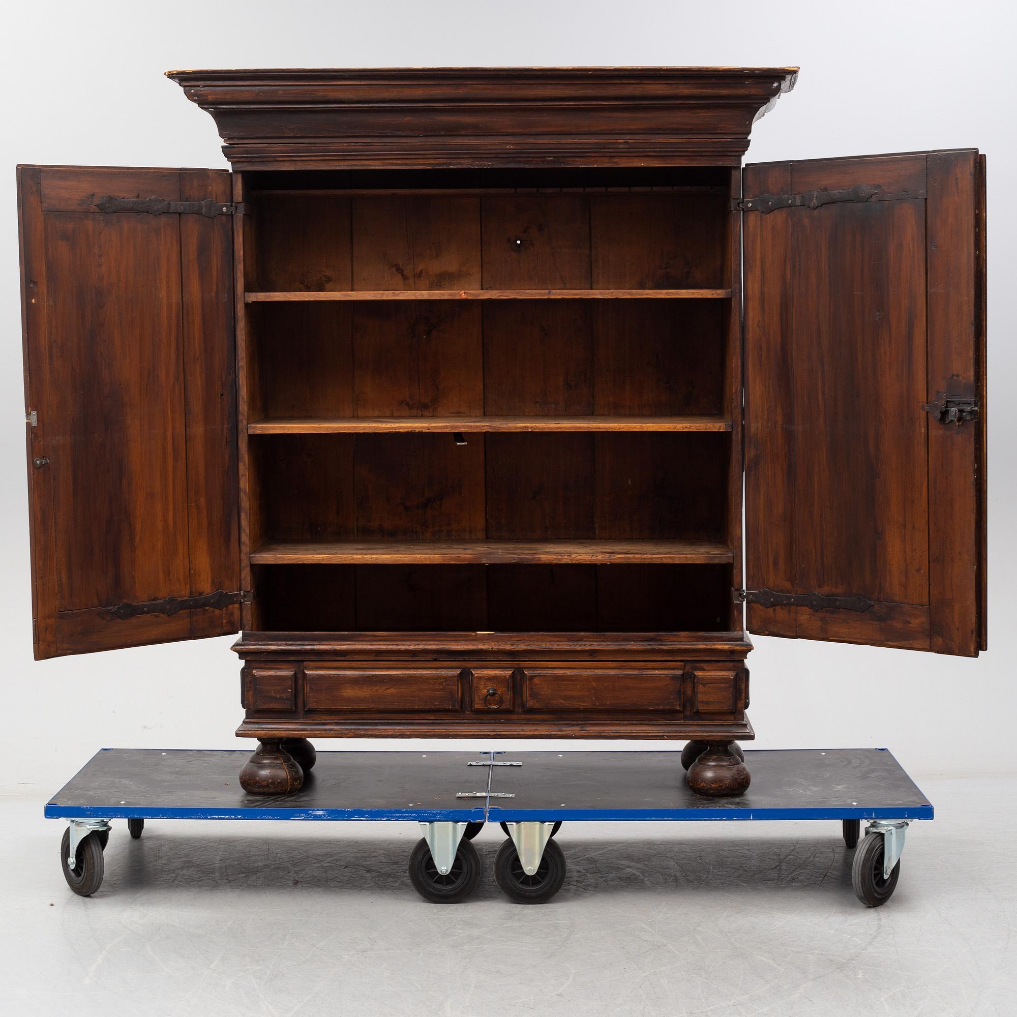 A first half of the 18th Century Baroque stained pine cabinet.