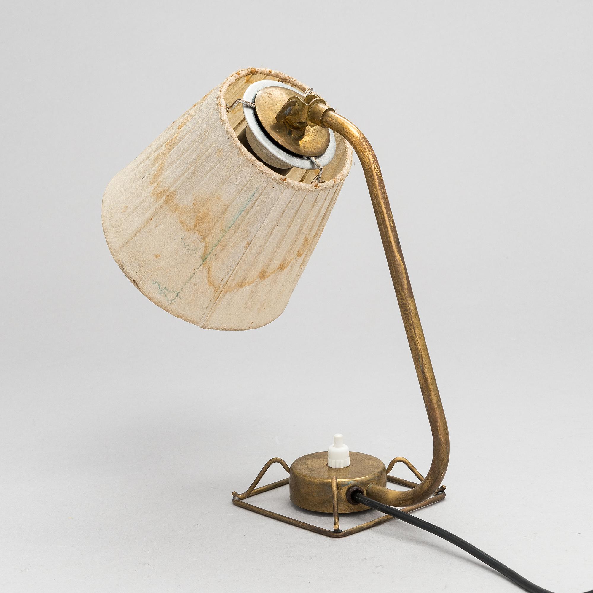 A mid-20th-century table lamp
/wall light for Idman.