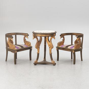 A pair of chairs and a side table, second half of the 20th century. Empire style.