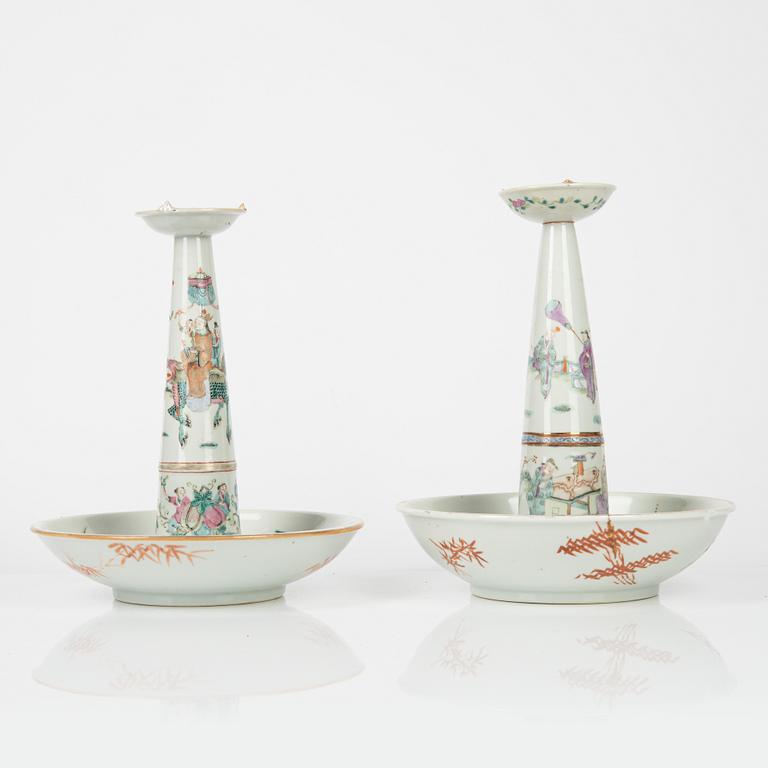 A pair of Chinese famille rose candles sticks, Qing dynasty, 19th Century.