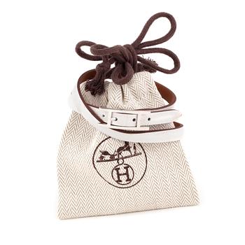 314. HERMÉS, a whote leather bracelet, "Hapi".