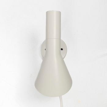 Arne Jacobsen, An 'AJ' wall lamp. Louis Poulsen, 21st century.