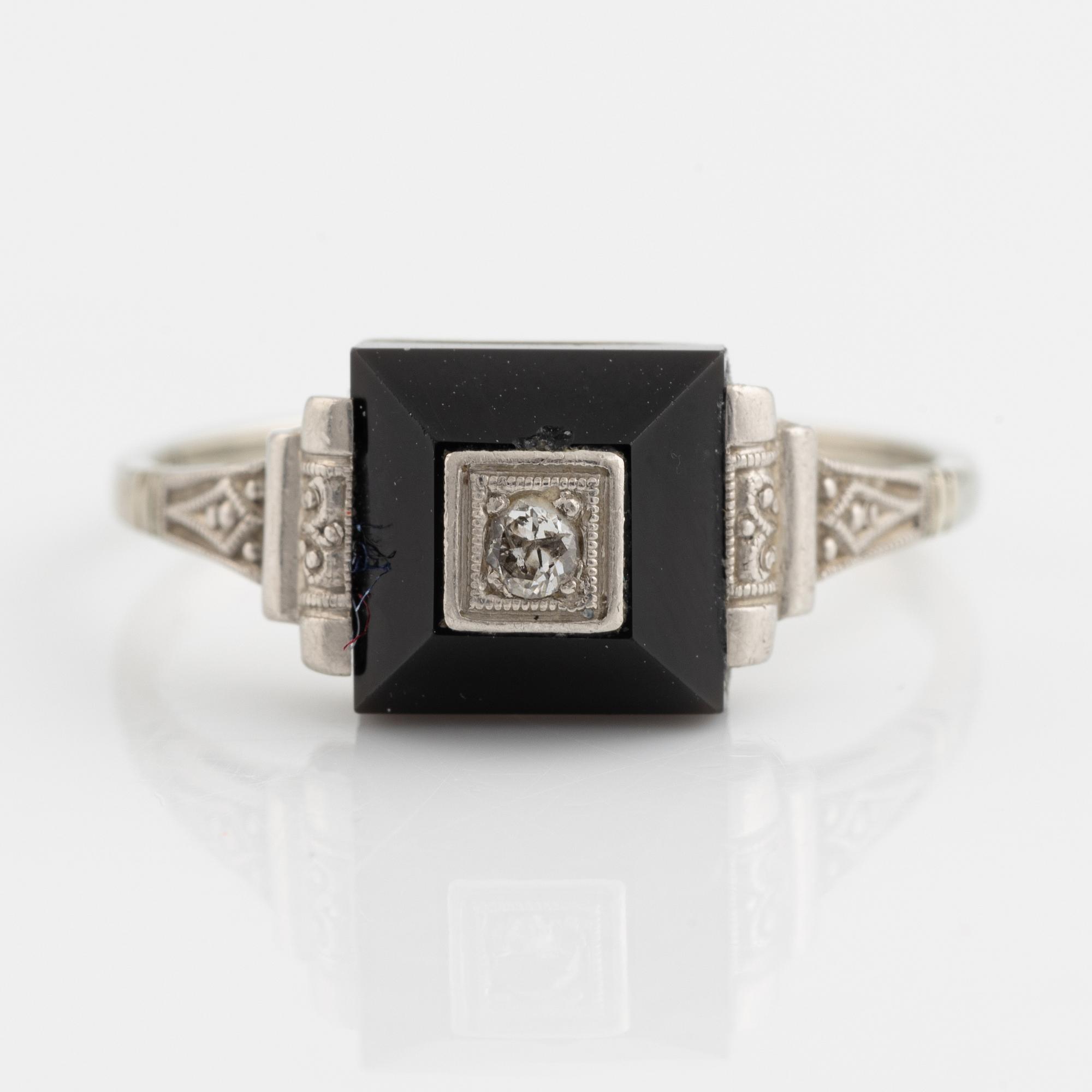18K white gold, onyx with round brilliant cut diamond ring.