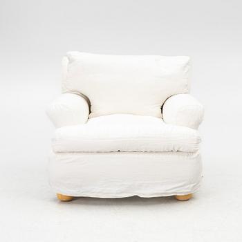 An armchair, contemporary.
