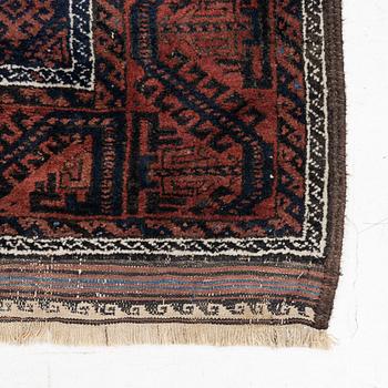 A semi-antique rug, baluch, including flat weave ca. 216 x 110 cm.