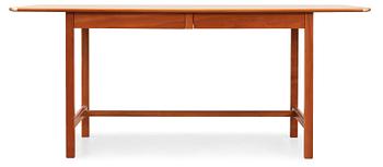 A Josef Frank ash and mahogany desk with brass fittings, by Svenskt Tenn.