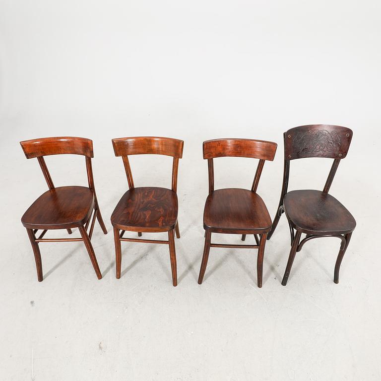 A set of four different early 1900s chairs.