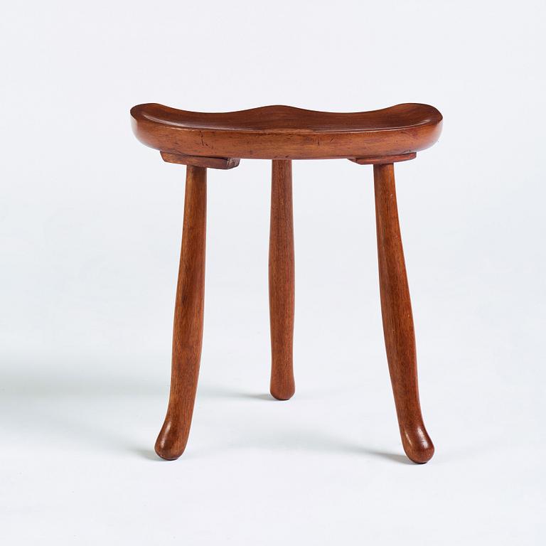 Josef Frank, a three legged mahogany stool, model 336, Svenskt Tenn, Sweden 1940-1950s.