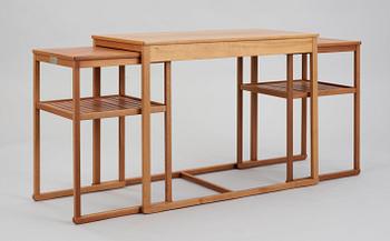 A Carl Malmsten teak set of occasional tables.