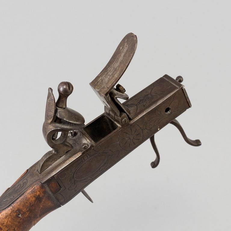 A FLINTLOCK LIGHTER, iron, 18th century.