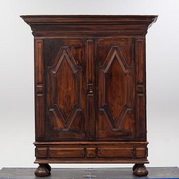 A first half of the 18th Century Baroque stained pine cabinet.