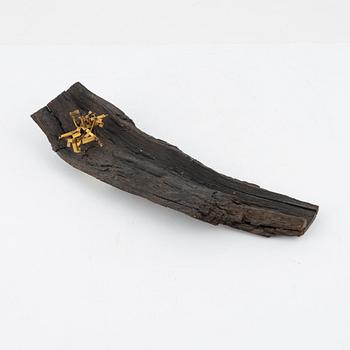 Arne Jones, sculpture, brass on driftwood, signed on label by the estate.
