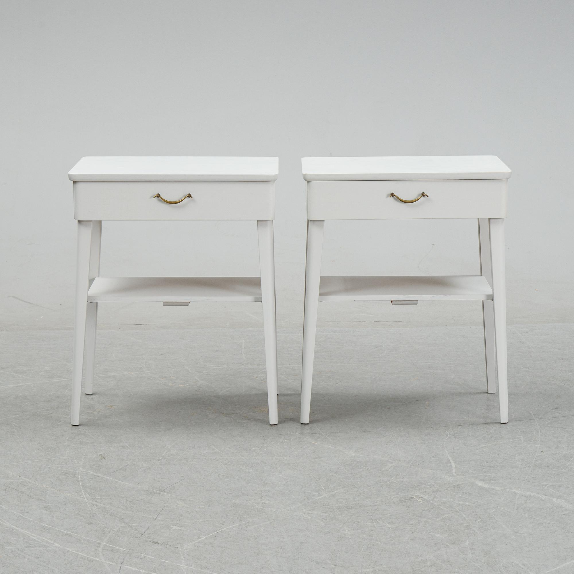 A pair of mid 20th century bedside tables.
