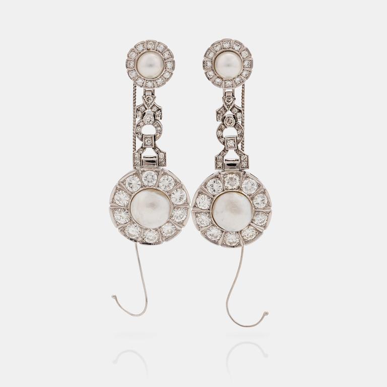 A pair of probably natural saltwater pearl, cultured pearl and brilliant cut diamond earrings.