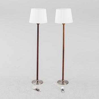 Uno & Östen Kristiansson, a pair of rosewood veneered floor lights, Luxus, Vittsjö, 1960's.