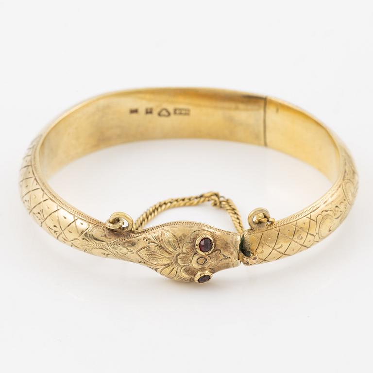 Armring i form av orm, 18K guld med granater som ögon, Johan Gustaf Kihlberg, Nyköping 1863.