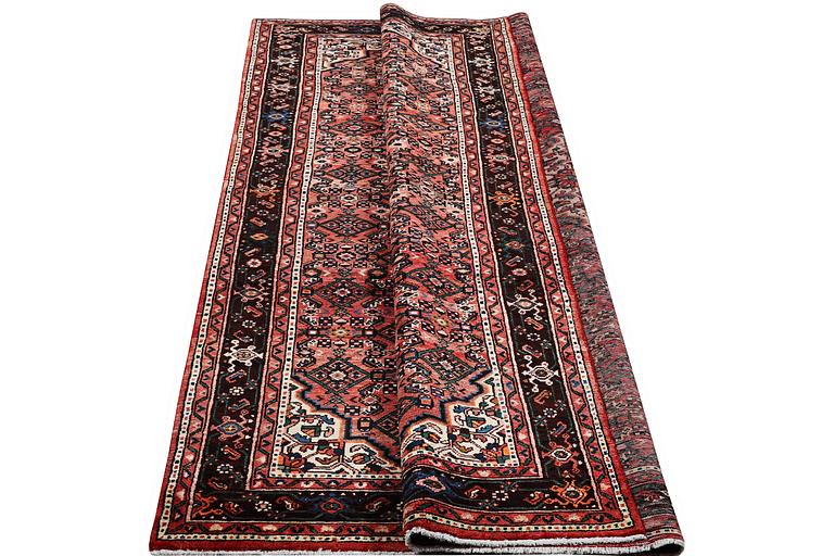 A carpet, Hosseinabad, c. 303 x 218 cm.