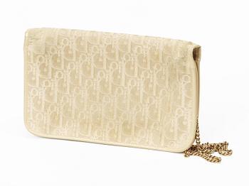 A clutch and sunglasses by Christian Dior.