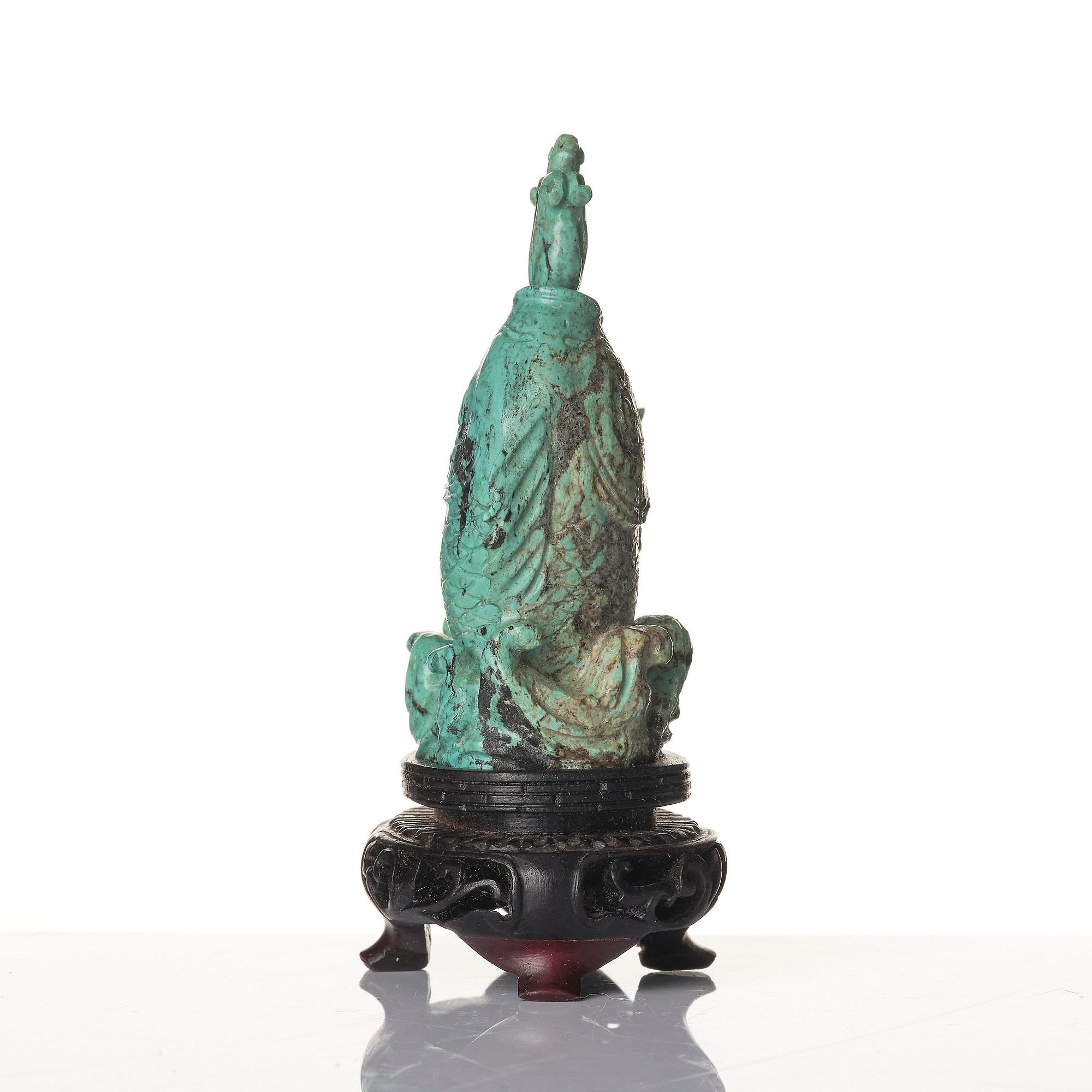 A well sculptured turquoise figure of a carp, Qing dynasty, 19th century.