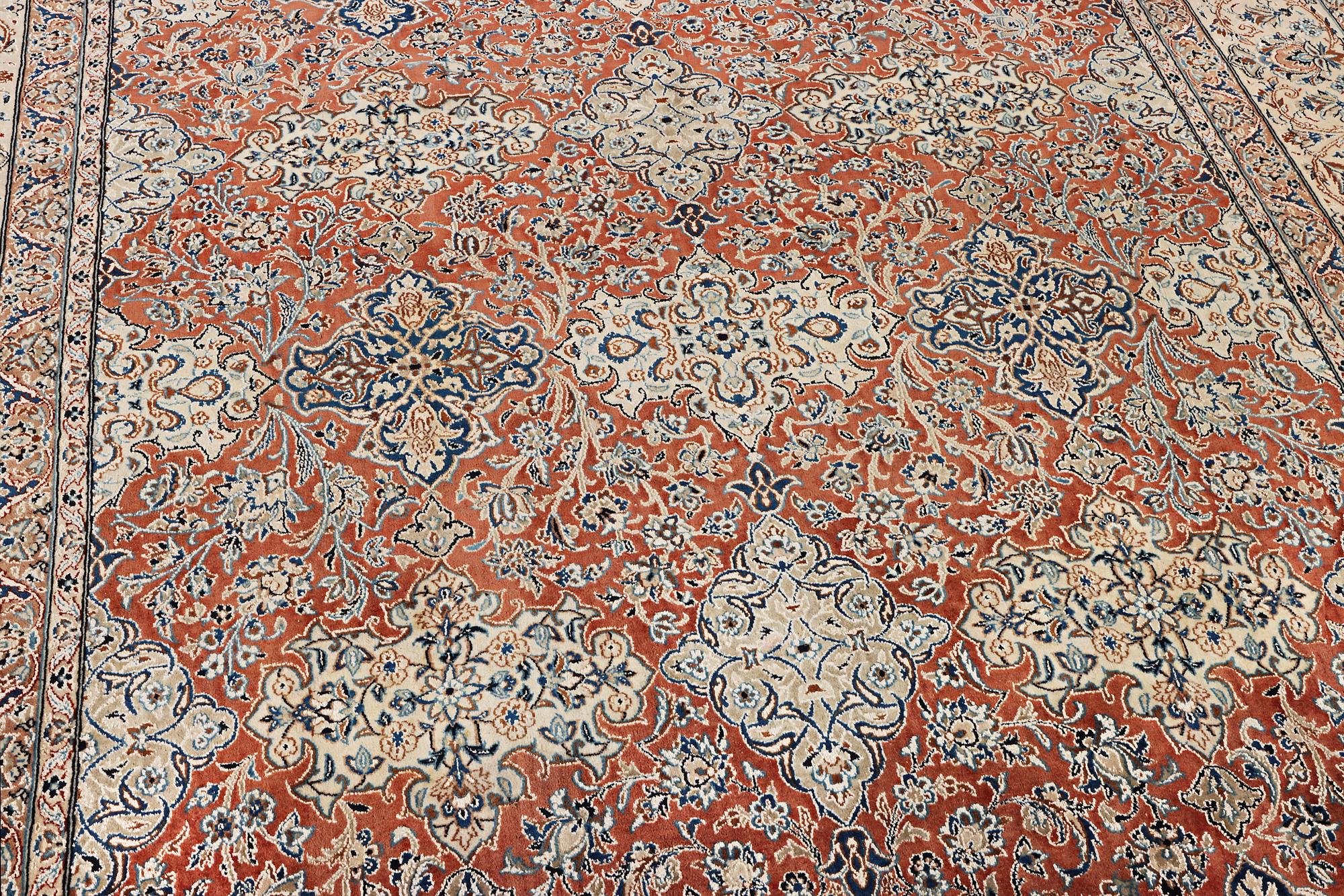 A semi-antique/old Nain carpet, part silk, c. 343 x 230 cm.