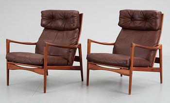 A pair of Ib Kofod Larsen teak and brown leather easy chairs, OPE Möbler, Sweden 1960's.