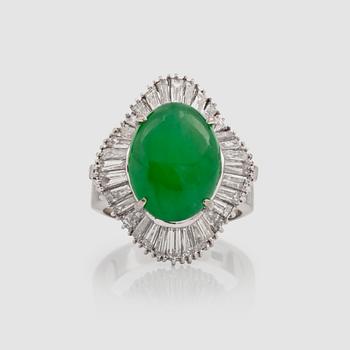 An untreated jadeite, 5.80 cts, and trapeze-cut diamonds, 3.50 cts in total, ring.