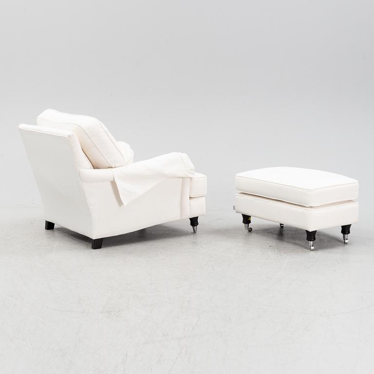 An easy chair with ottoman from Englesson, 21st century.