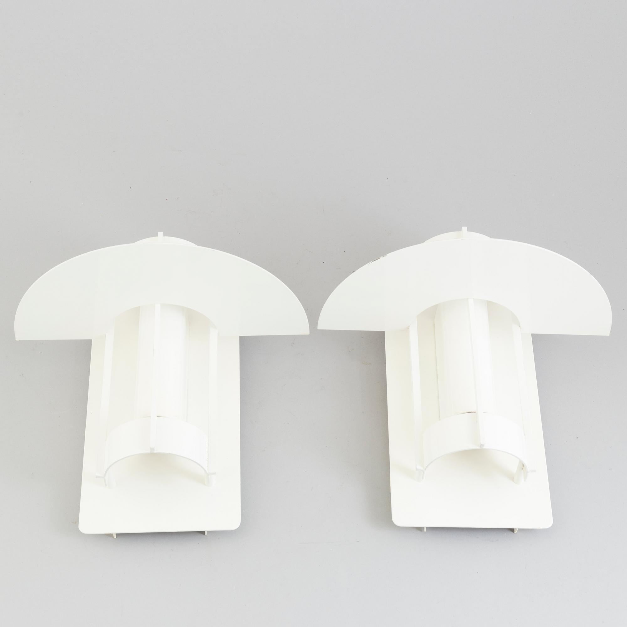 A set of two wall lamps by Joachim Lepper for Louis Poulsen, Danmark.