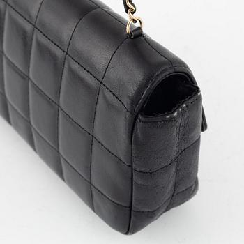 Chanel, a chocolate bar quilted black leather 'East West' crossbody bag.